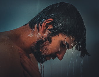 Moody Portrait of Wet Bearded Man in Shower