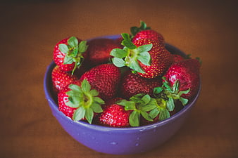 Fresh Red Strawberries in a Purple Bowl on Wooden Table