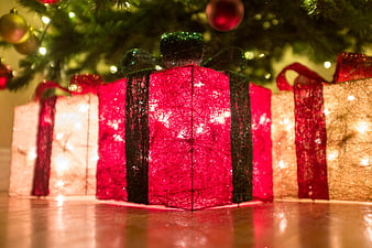 Glowing Christmas Gift Boxes Under Tree