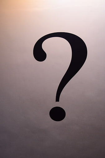 Black question mark symbol on textured white paper background