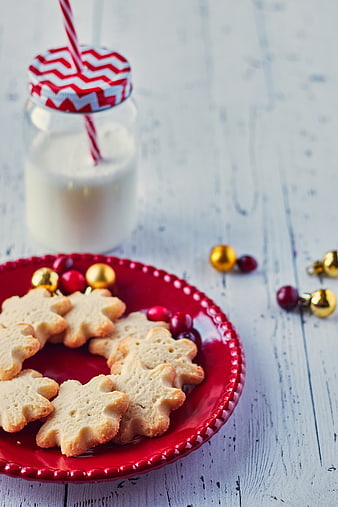 Christmas shortbread cookies and milk on rustic table