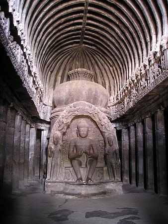 Ancient Buddhist Cave Temple Interior with Buddha Statue