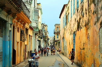 Colorful Havana Street Scene with Tourists and Vintage Architecture