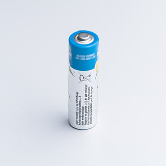 Single AA Battery on White Background