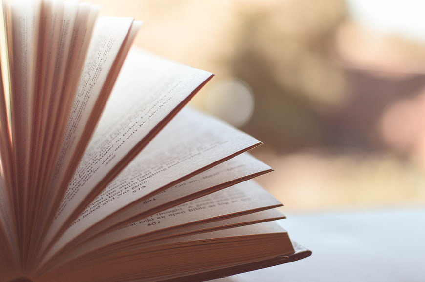 Close-up of open book pages with blurred background