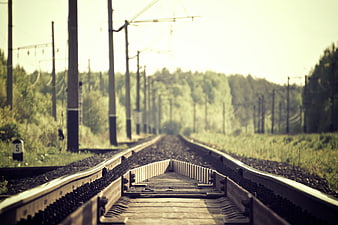 Vintage Railway Tracks with Wooden Ramp and Overhead Wires