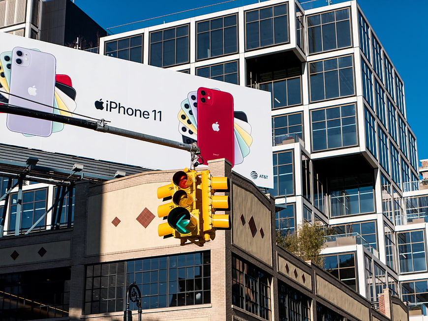 iPhone 11 Billboard on City Building with Traffic Light