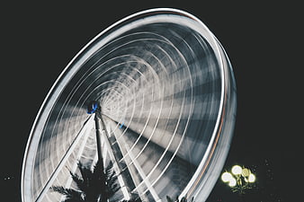 Long Exposure Ferris Wheel at Night with Light Trails