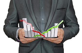 Businessman holding 3D financial growth chart on tablet
