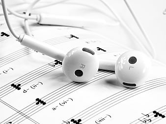 White Earphones on Sheet Music