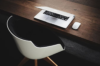 Minimalist Workspace with Laptop on Wooden Desk