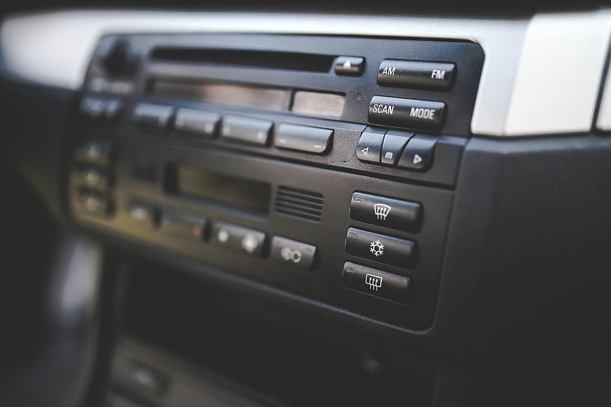 Close-up of vintage car dashboard radio and climate controls