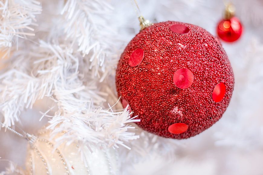 Red Glitter Christmas Ornament on White Tree