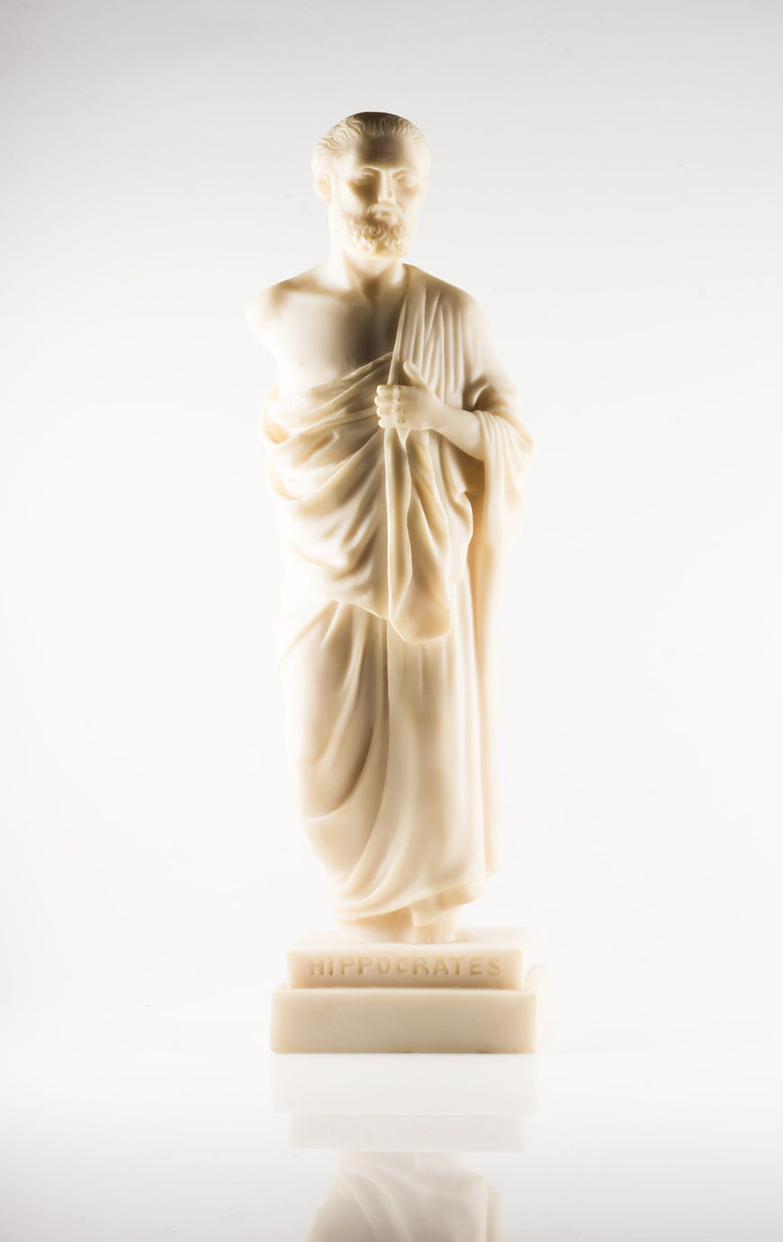 Ivory Hippocrates Statue on White Background