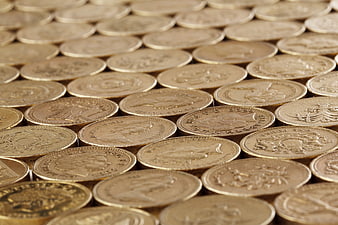 Close-up of stacked gold coins with shallow depth of field