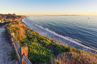 Coastal Pathway with Wooden Fence and Ocean View