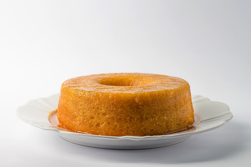 Traditional Orange Flan Cake on White Plate
