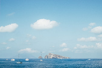 Sailboats and yachts near Capri island in the Mediterranean Sea