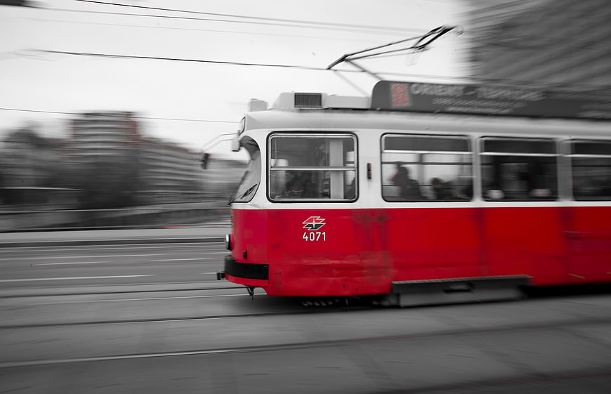 Red Vienna Tram in Motion on Urban Tracks