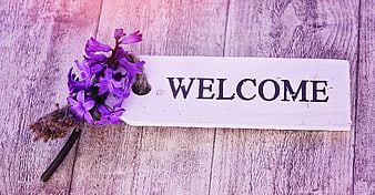 Purple Hyacinth Flower on Wooden Welcome Sign