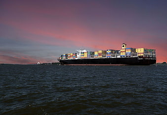 Container Ship Sailing on River at Sunset
