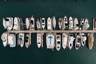 Aerial view of luxury yachts docked in a marina