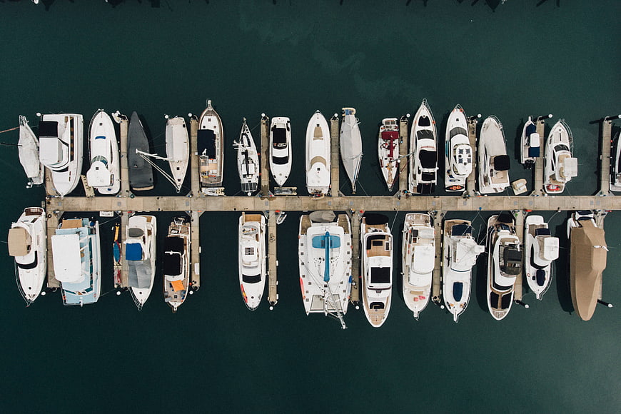 Aerial view of luxury yachts docked in a marina