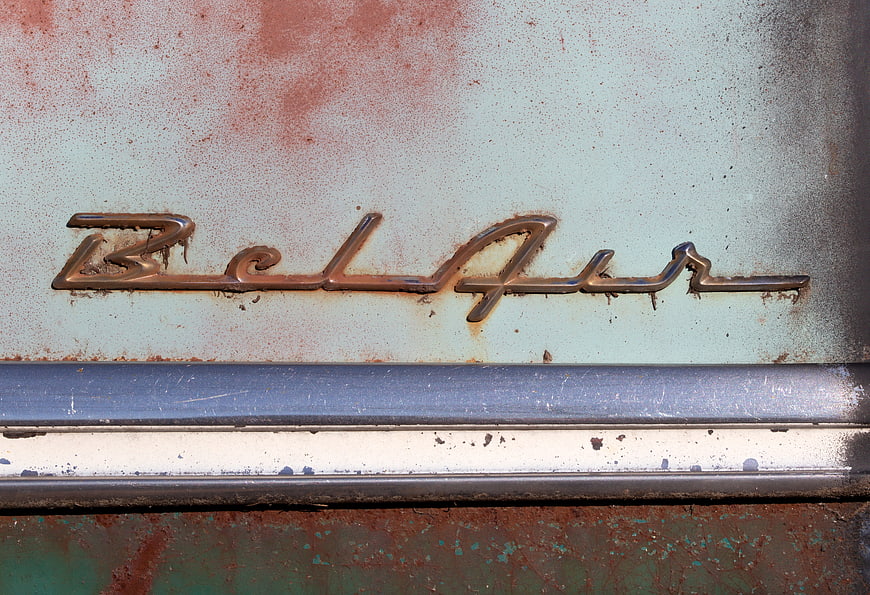 Vintage Bel Air Car Emblem with Rust and Chrome Detail
