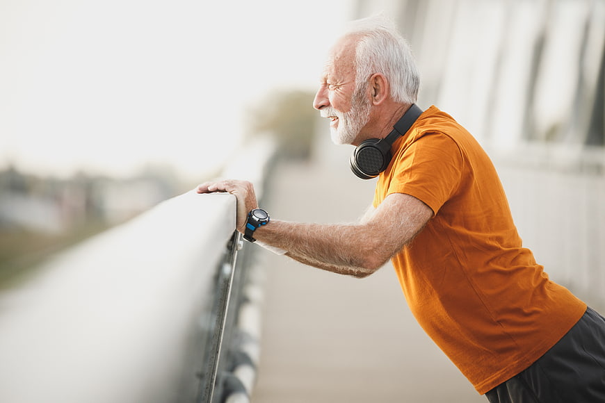 Active Senior Man Resting After Outdoor Workout