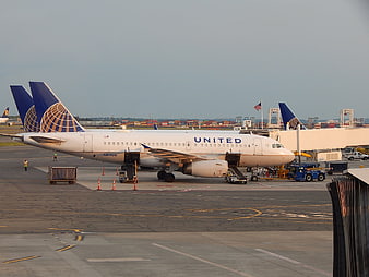 United Airlines Airplane Parked At Airport Gate