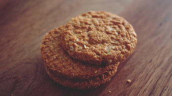 Stack of oatmeal cookies on wooden table