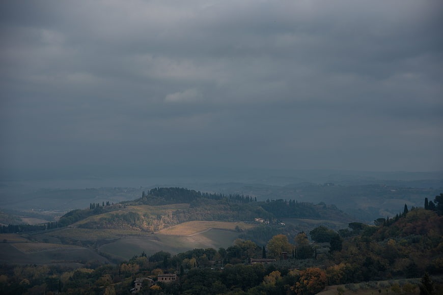 Moody Tuscany Landscape with Rolling Hills and Overcast Sky