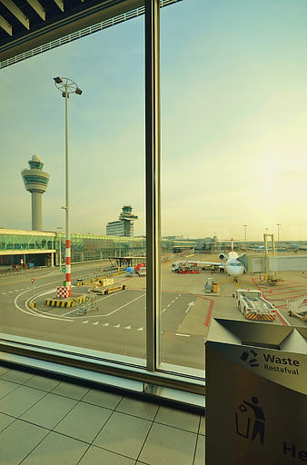 Airport Terminal View with Airplane and Control Tower