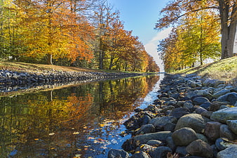 Autumn Canal with Vibrant Fall Foliage and Reflections