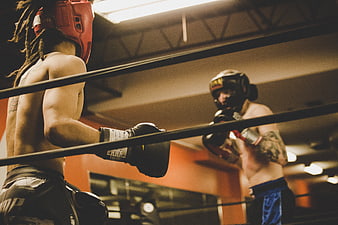 Two Boxers Sparring in a Gym Ring
