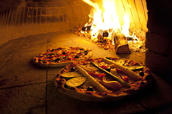 Fresh Pizzas Baking in Traditional Wood-Fired Oven