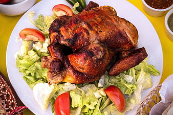 Roasted Chicken on Salad Plate with Tomatoes and Sauces