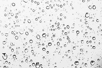 Raindrops on glass window texture background