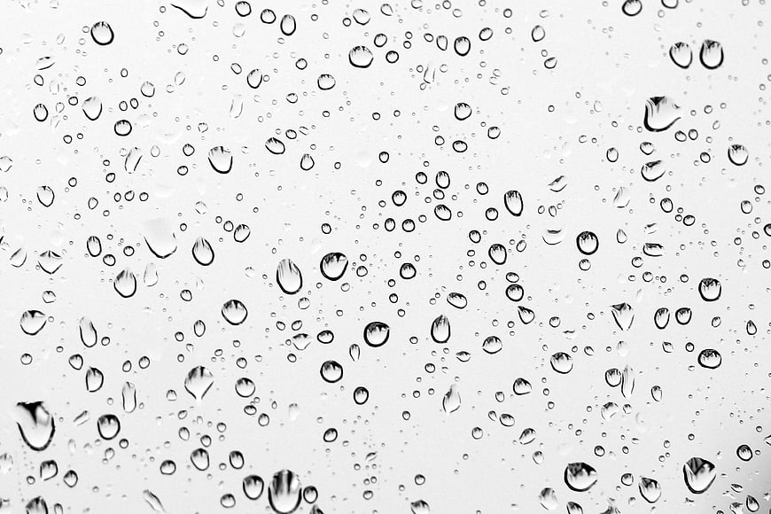 Raindrops on glass window texture background