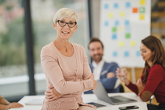 Confident Senior Businesswoman in Modern Office Meeting