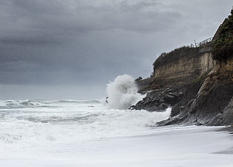 Stormy Ocean Waves Crashing Against Rocky Cliffs