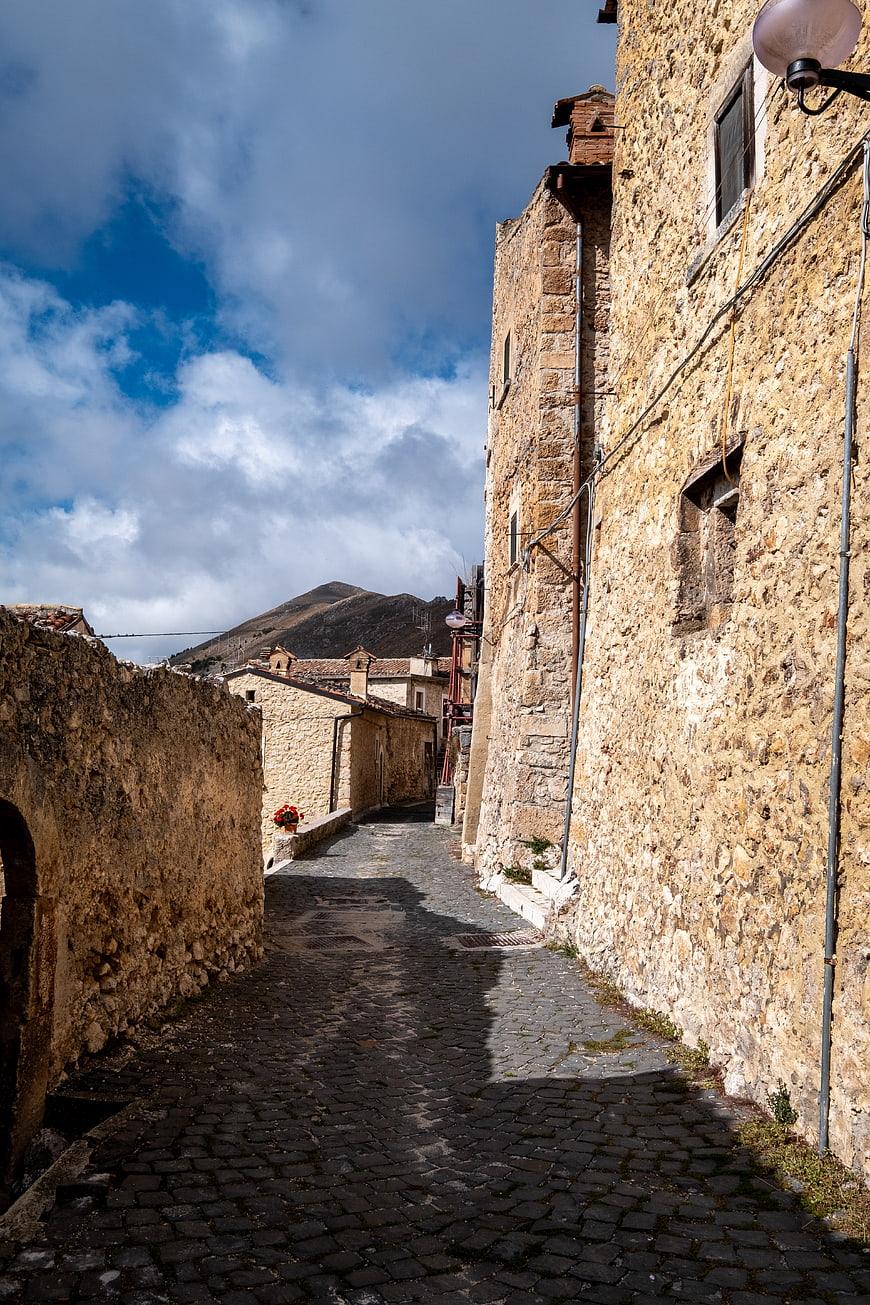Narrow cobblestone alley in historic Italian village