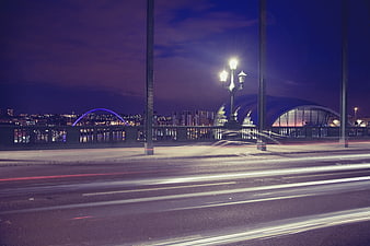 Long Exposure Night Cityscape with Light Trails and Bridge