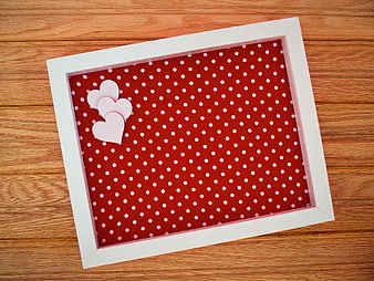 Red Polka Dot Frame with Hearts on Wooden Background