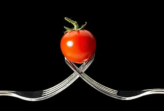 Cherry Tomato Balanced on Crossed Forks