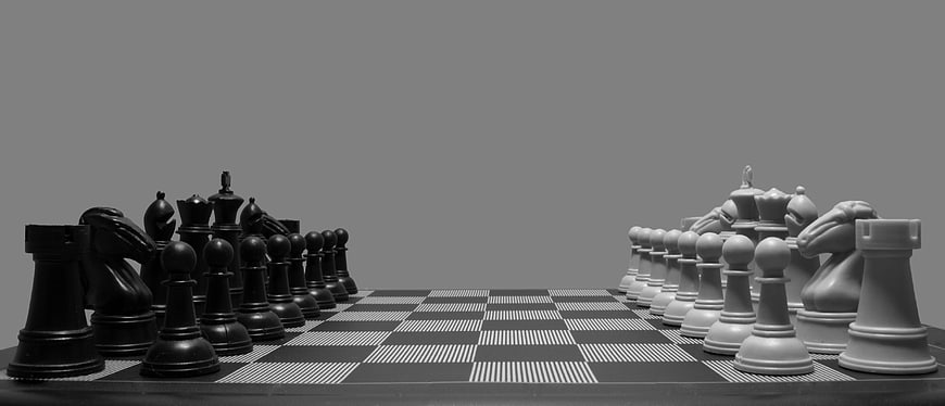 Black and White Chess Pieces on Board with Copyspace