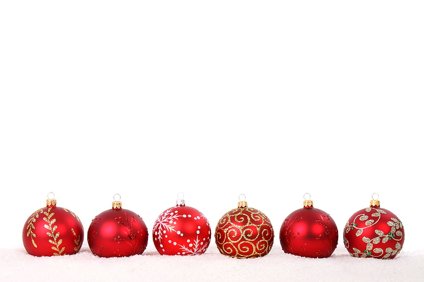 Red Christmas Ornaments On White Snow Background
