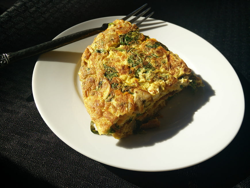 Spinach and Mushroom Omelette on White Plate with Fork