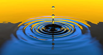 Water Drop Splash on Blue Surface with Yellow Background