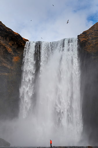 Skogafoss Waterfall Iceland with Person and Birds